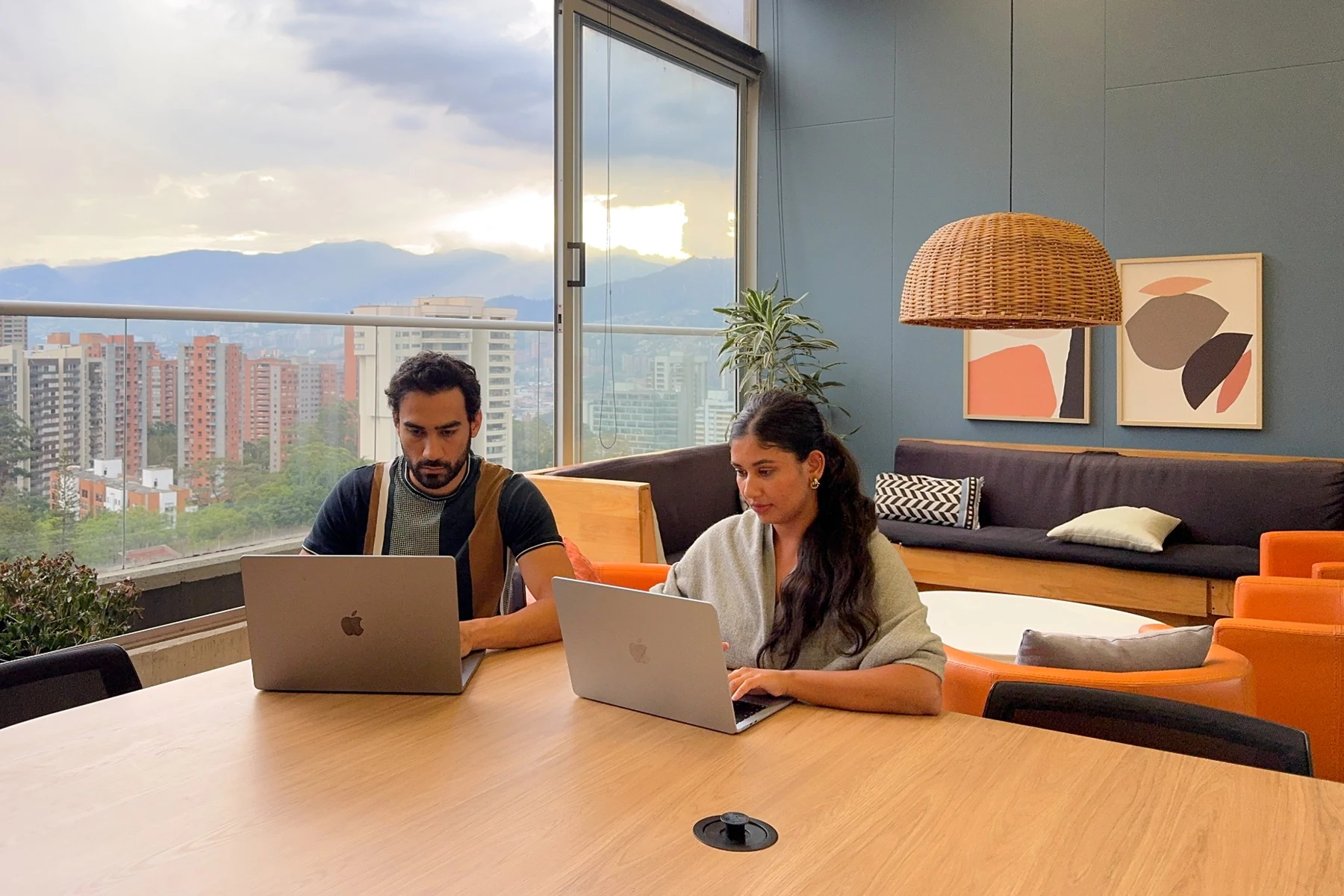 Hello Marshy co-founders Behroz Saadat and Maha Ali working side by side on their laptops