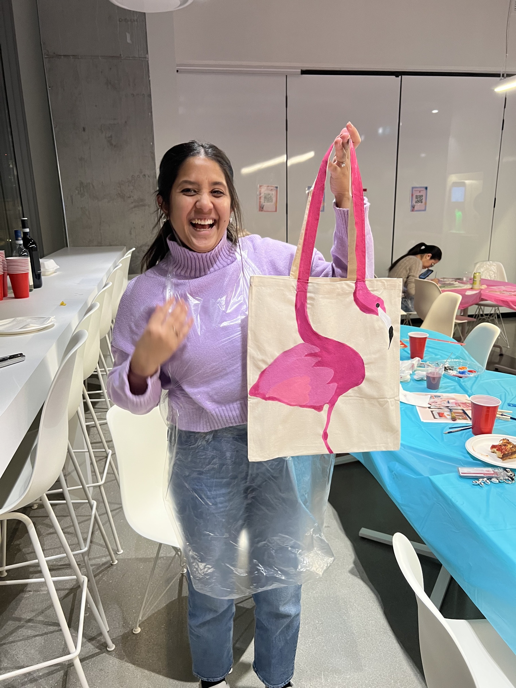 Workshop participant showing a finished tote bag