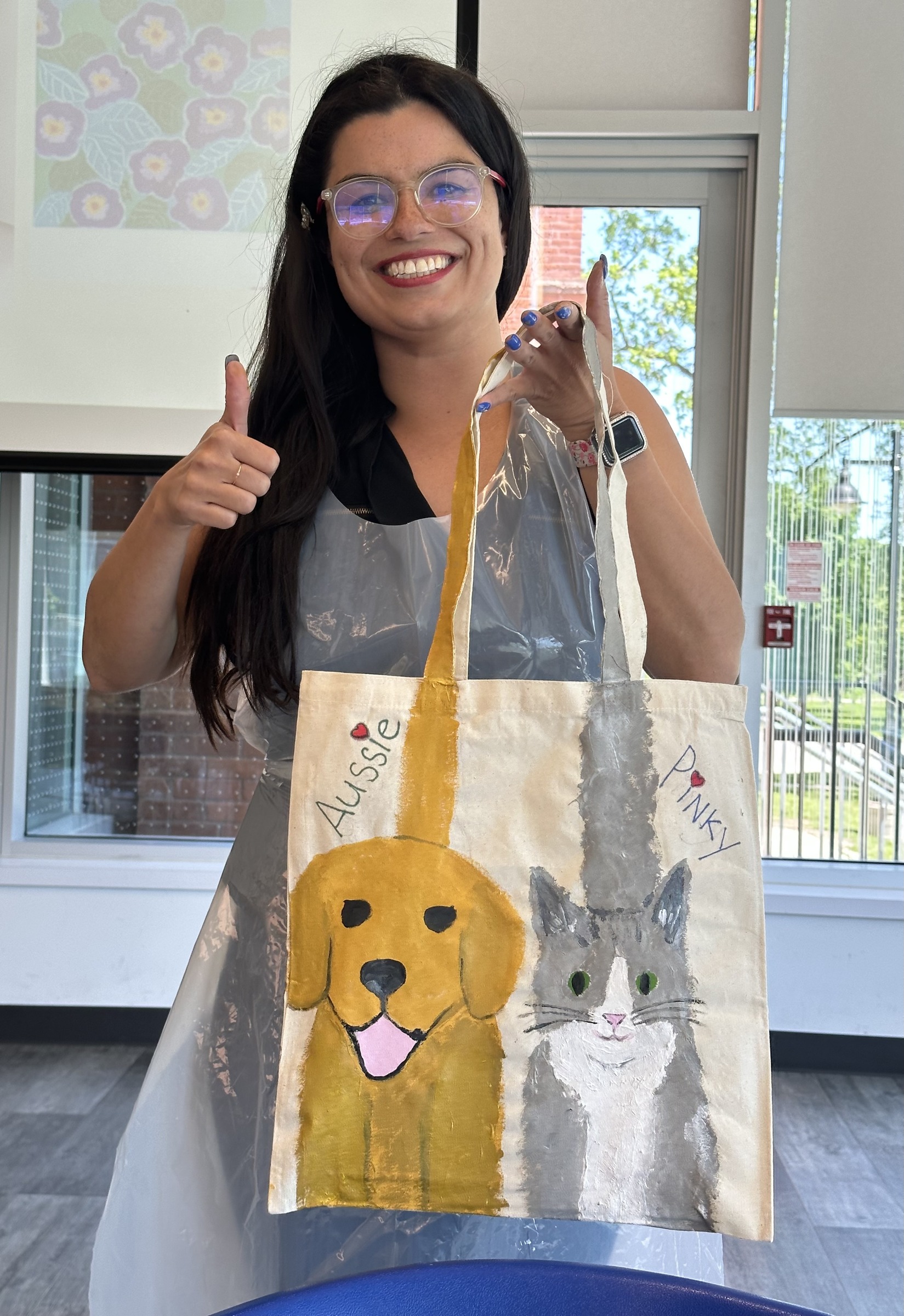 Workshop participant showing a finished tote bag