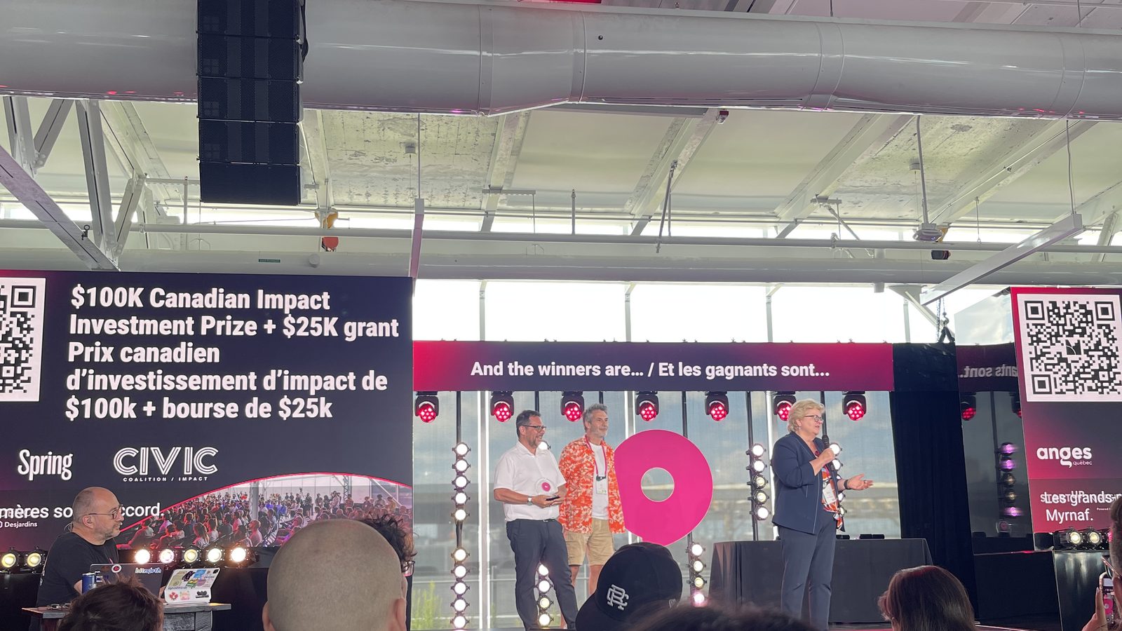 FinLeaf Technologies winners on stage beside the Canadian Impact Investment Prize banner